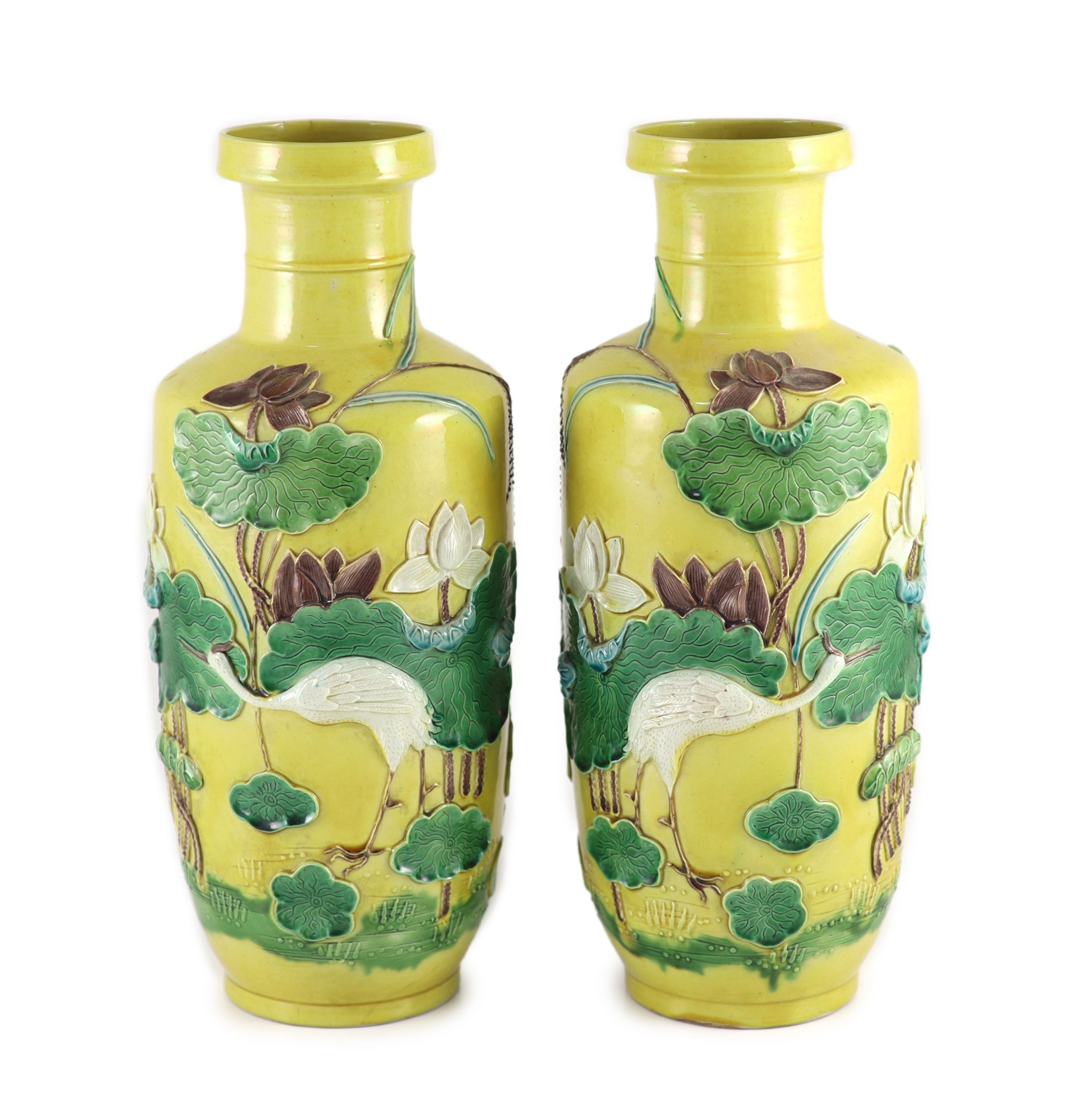 A pair of Chinese yellow ground ‘crane and lotus’ rouleau vases, Qianlong seal mark, early 20th century 34.5 cm high